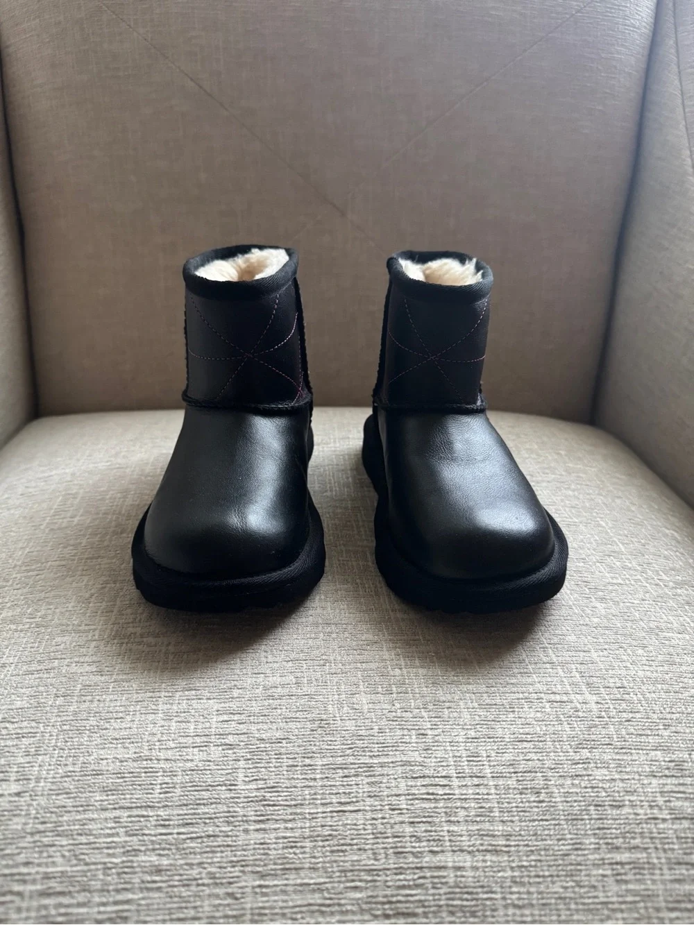 UGG Black Short Shearling Boots with Pink Stitching